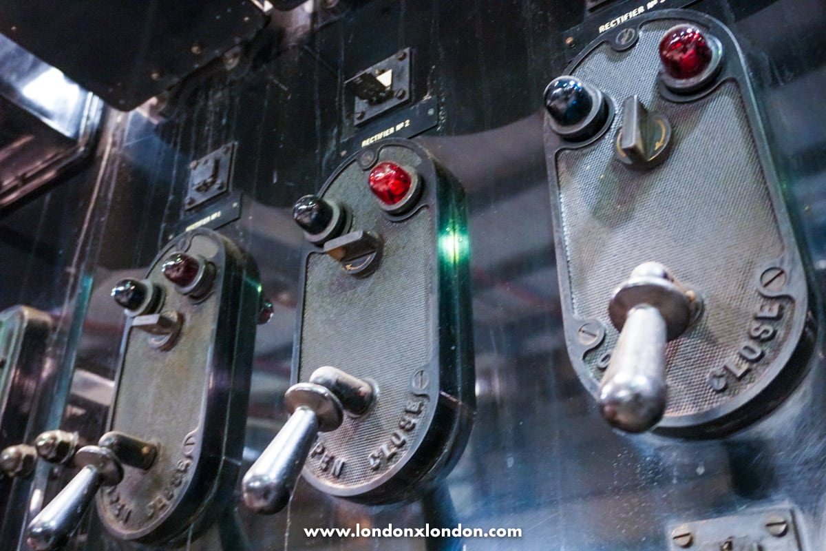 Close-up of heritage signalling levers and indicator lights in the signalling collection at the Depot