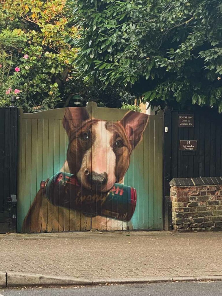 A dog and clutching his spray can by Irony. 