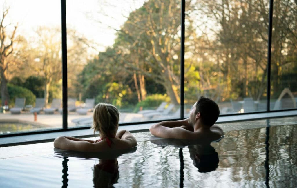 Couple relaxing in the indoor pool at South Lodge