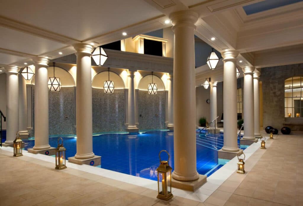 Indoor pool lined with columns at The Gainsborough Bath Spa hotel