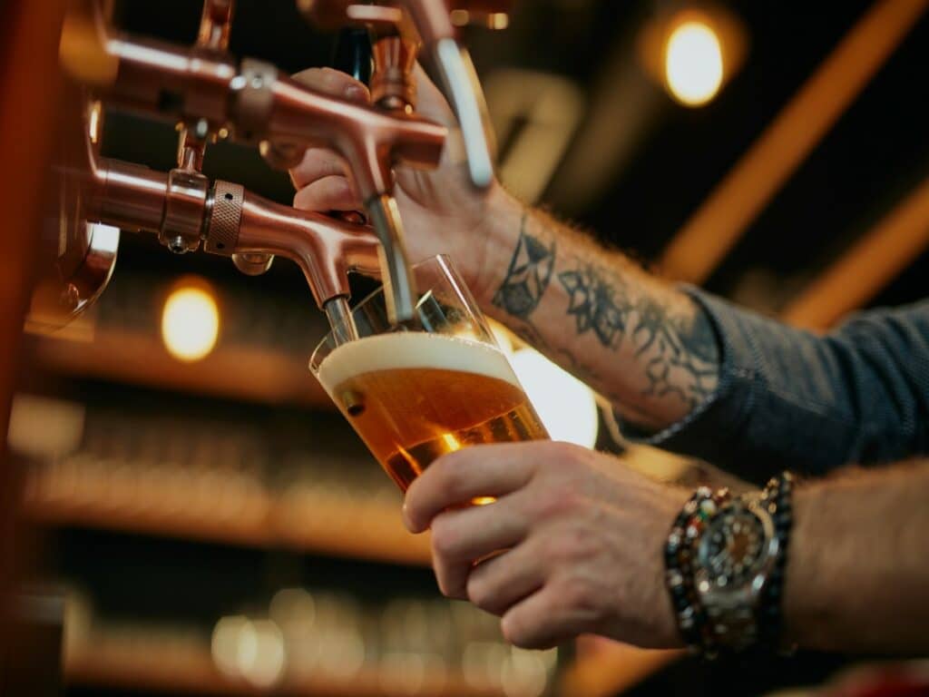 Bartender Pouring a Pint in a Pub