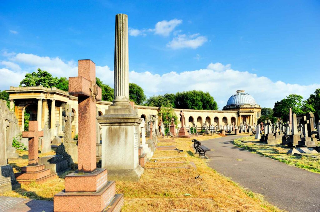 Gravestones and cross in cemetery in London