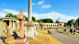 Gravestones and cross in cemetery in London