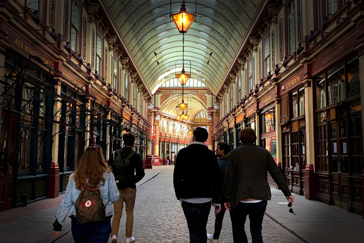 Leadenhall Market's covered arcade, lit up in the evening