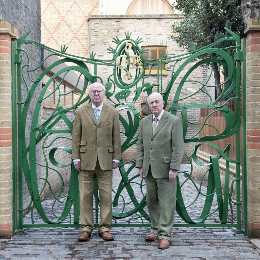 Gilbert & George portrait in front of Centre gates