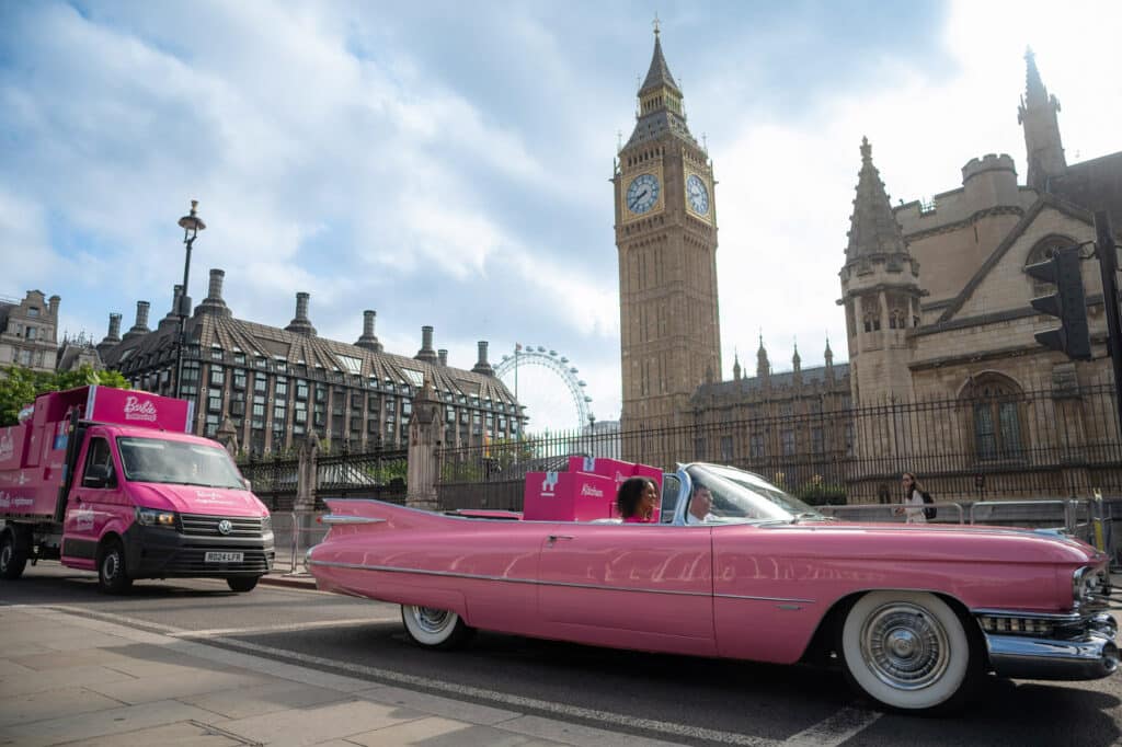 Barbie car driving past big ben