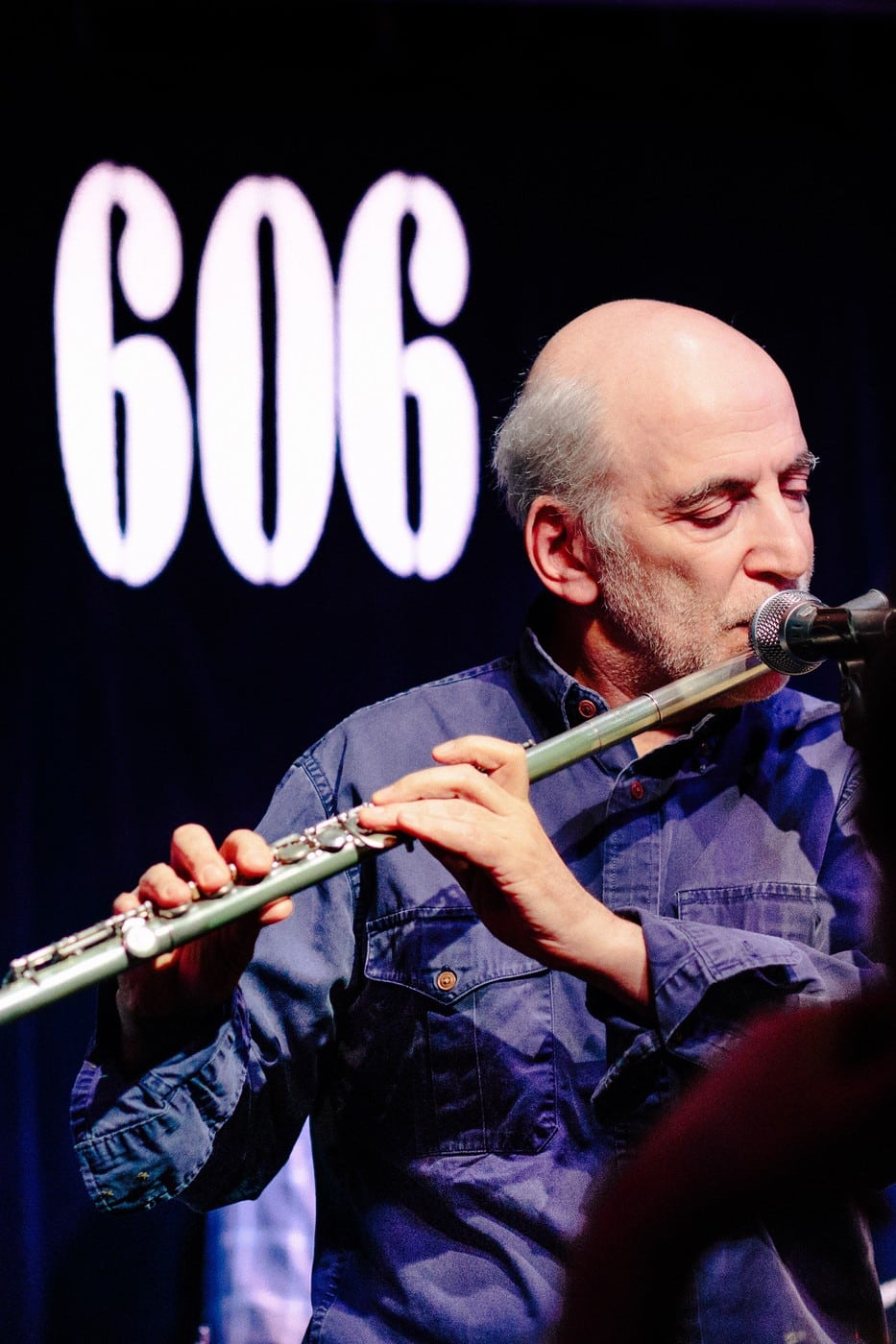 Steve Rubie playing flute on stage at the 606 Club