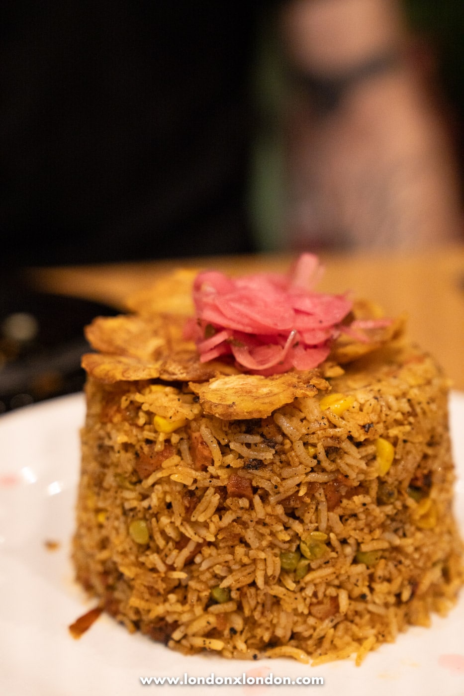 Arroz con Pollo topped with pickled red onion and plantain crisps at Chabela in Crystal Palace