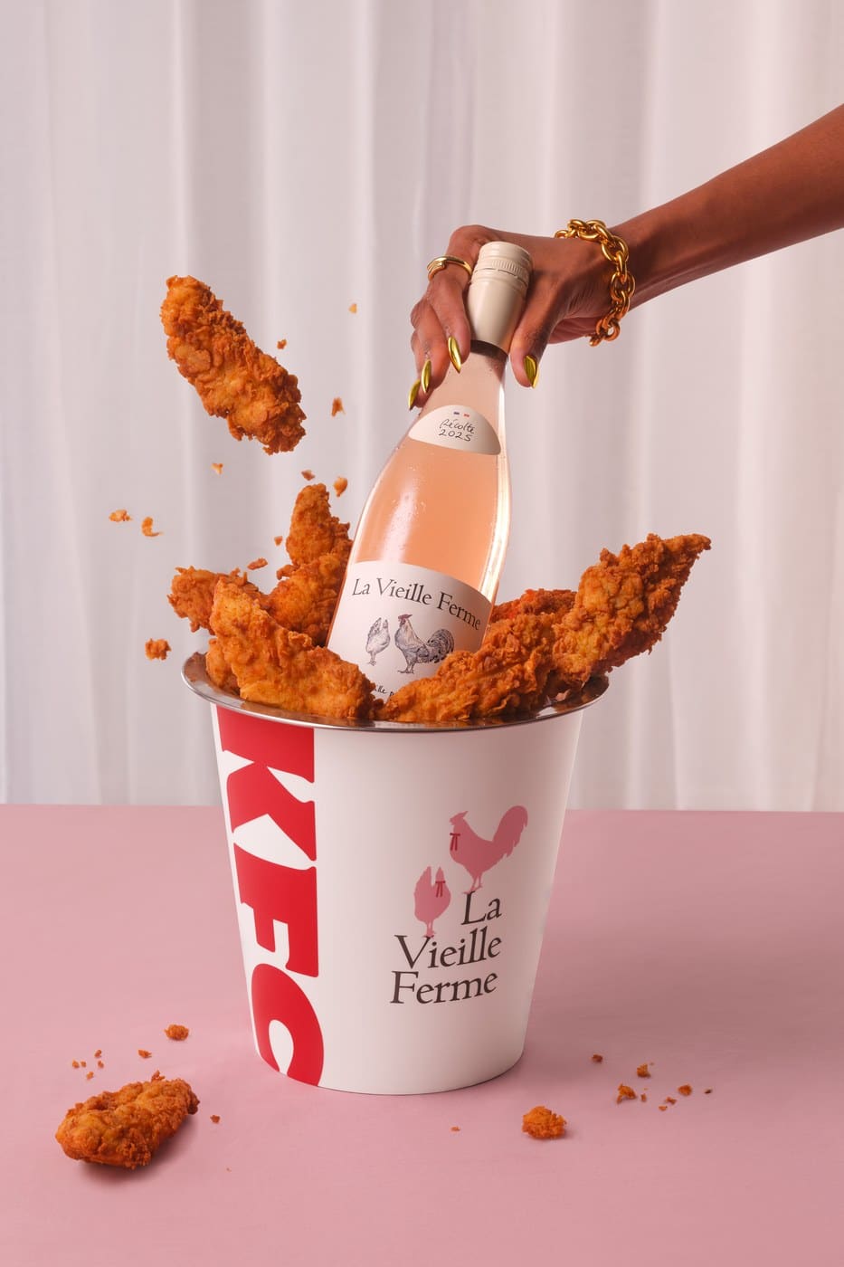 A KFC bucket with tenders and a bottle of La Vieille Ferme rosé for Coq au Vin