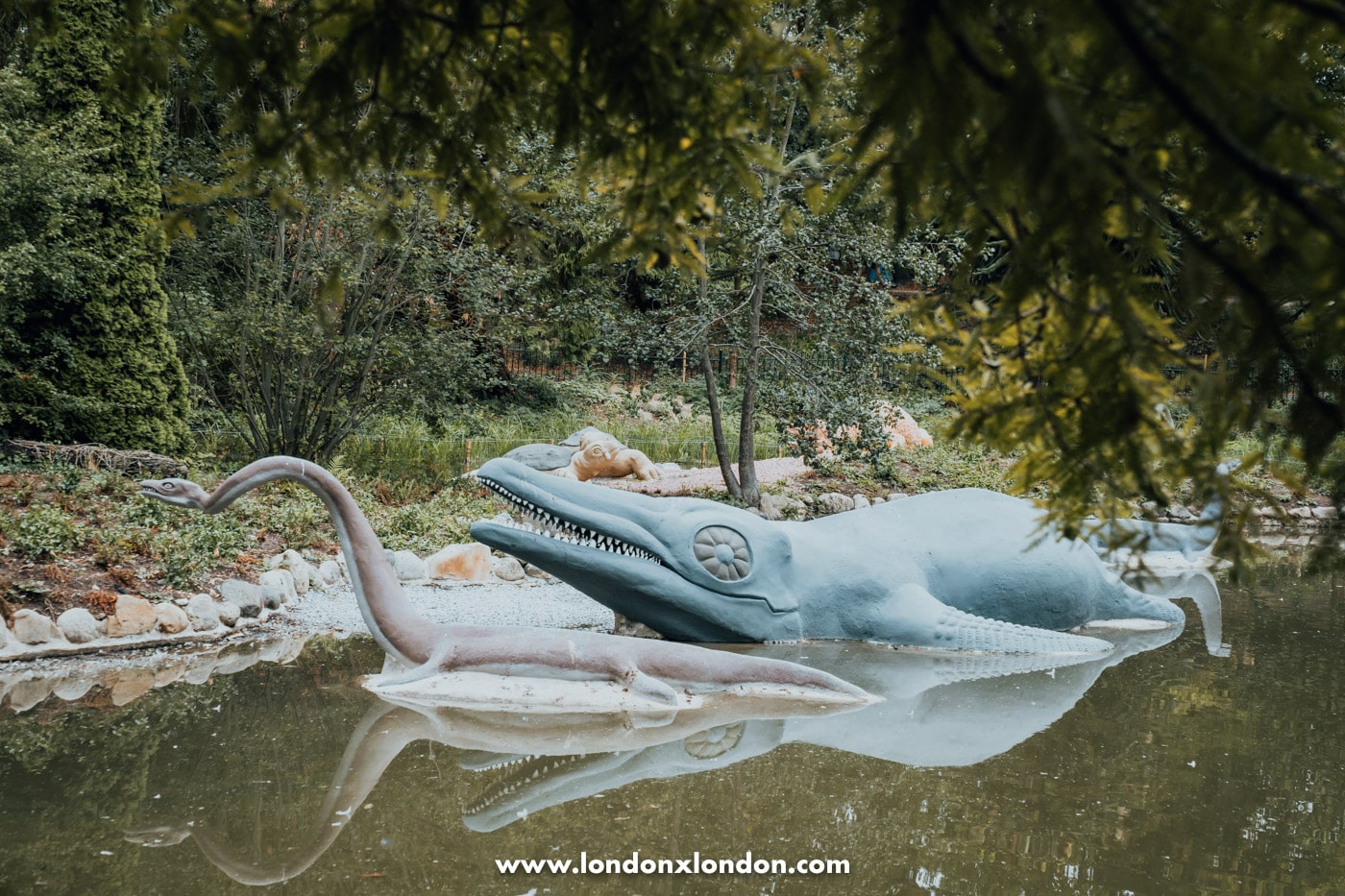 Restored ichthyosaur sculptures beside the lake at Crystal Palace Park