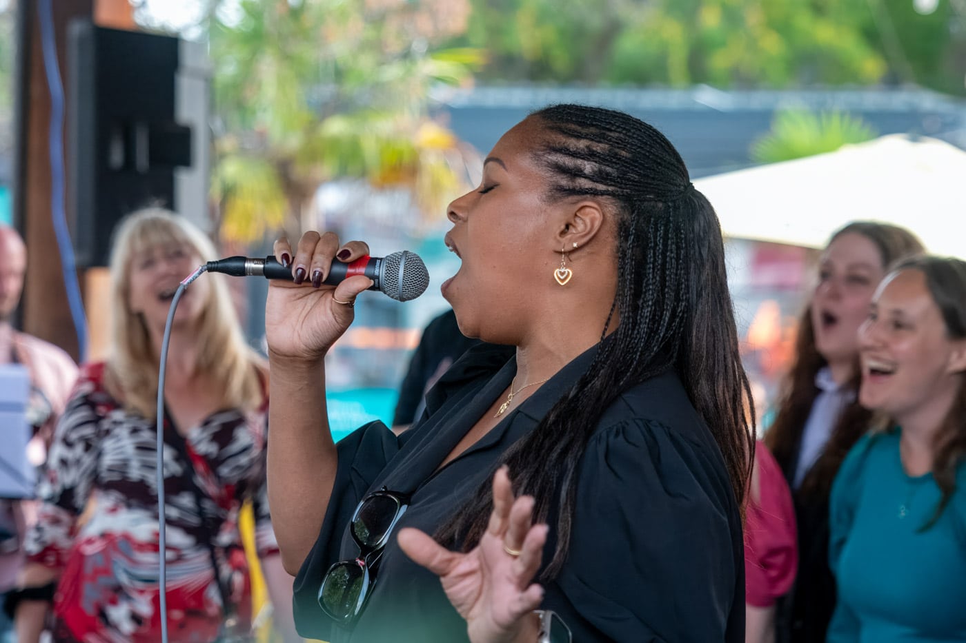 A singer performing to the crowd at the Gabriel's Wharf Arts Festival