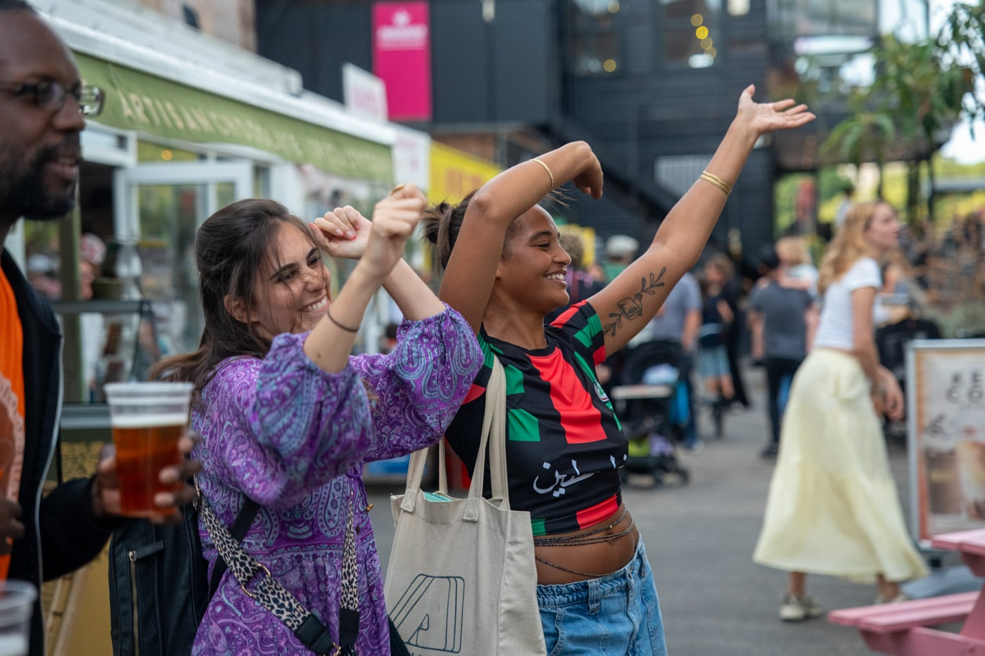 Two festival-goers dancing in the crowd at the Gabriel's Wharf Arts Festival