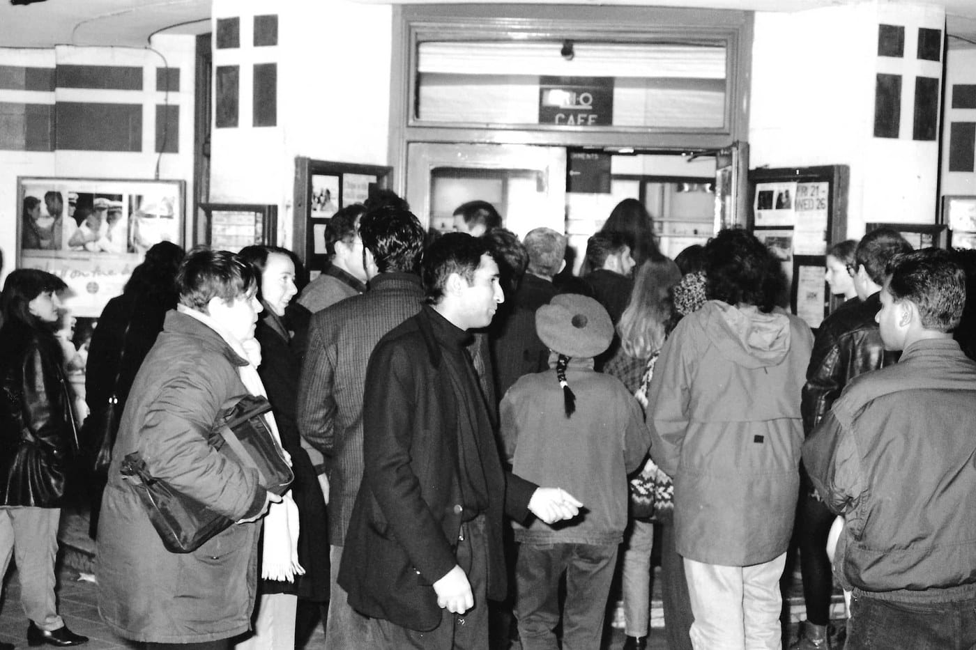 Black and white archive photo of an audience queuing at the Rio Cinema for Bhaji on the Beach in 1994