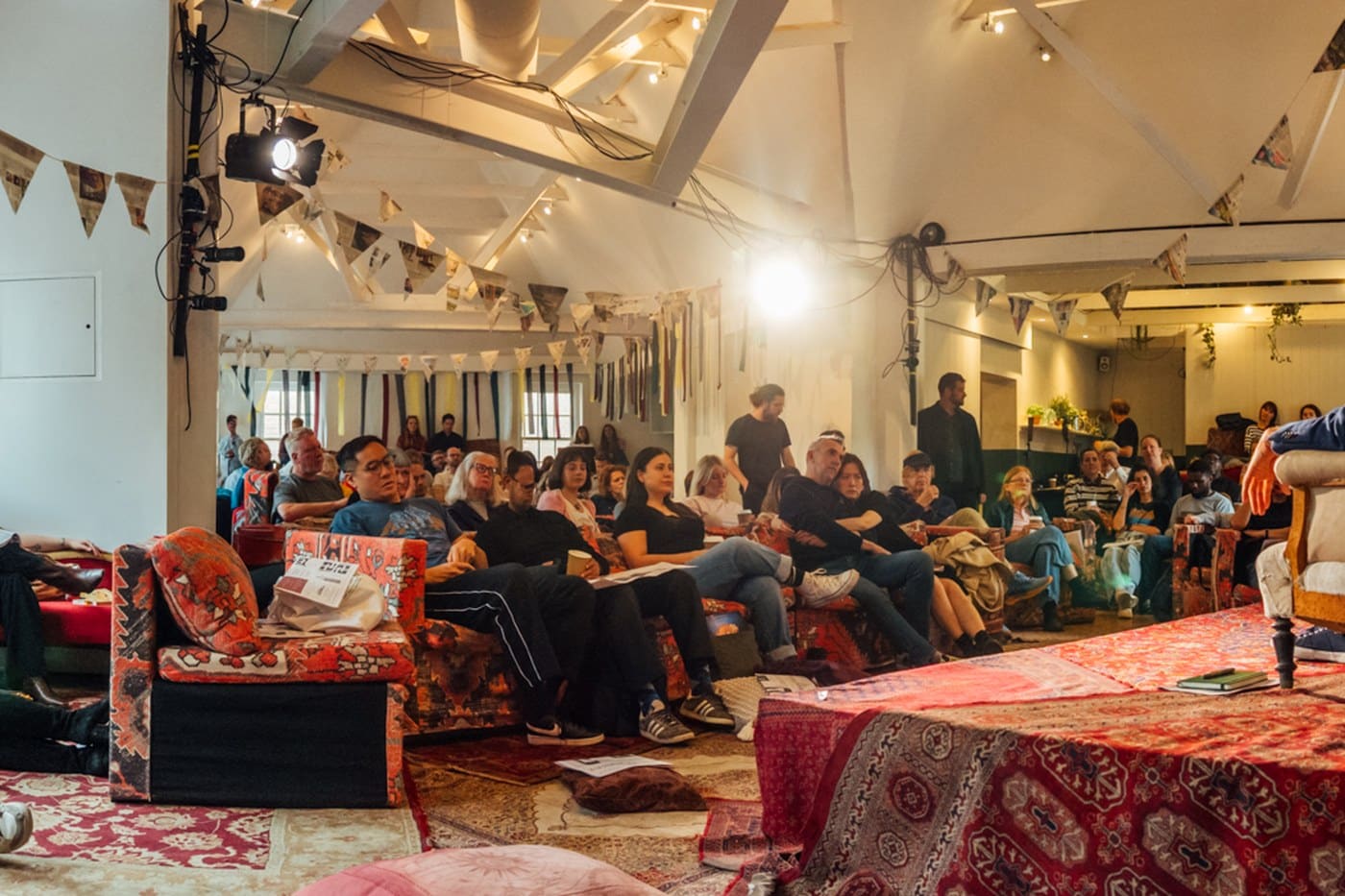 The main room at Sunday Papers Live, decorated with newspaper bunting