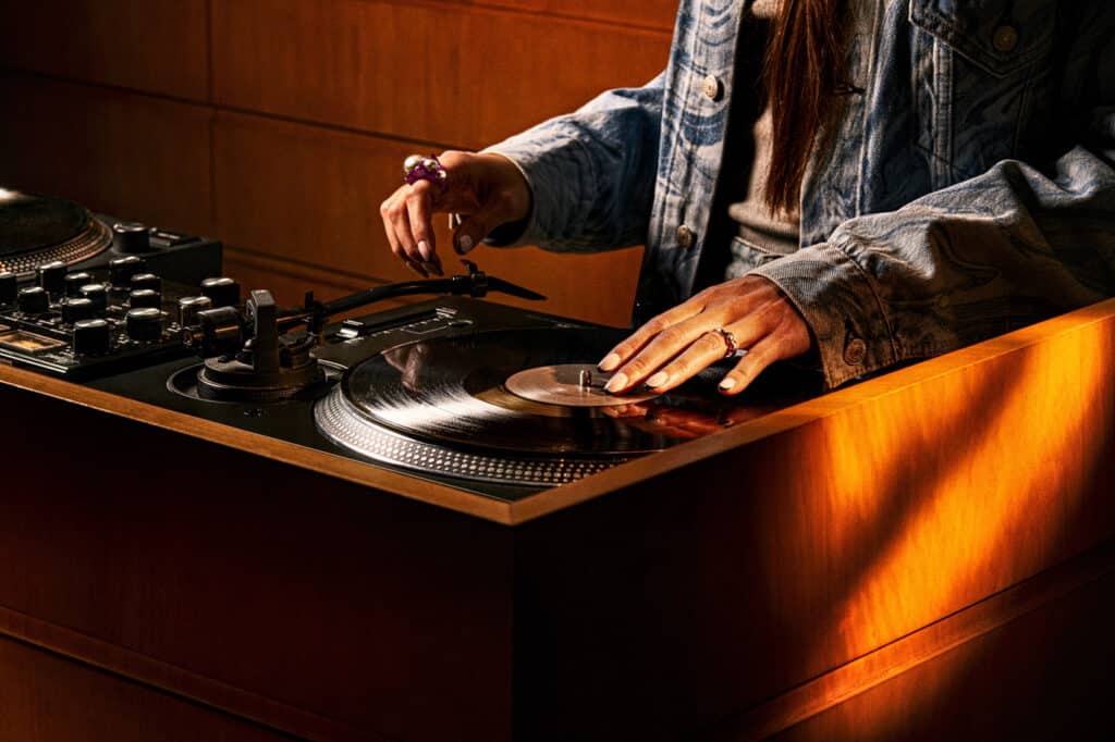 Man DJing on decks