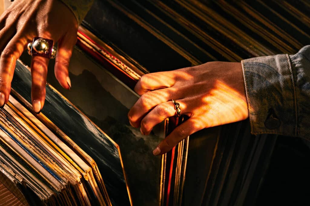 Man leafing through records