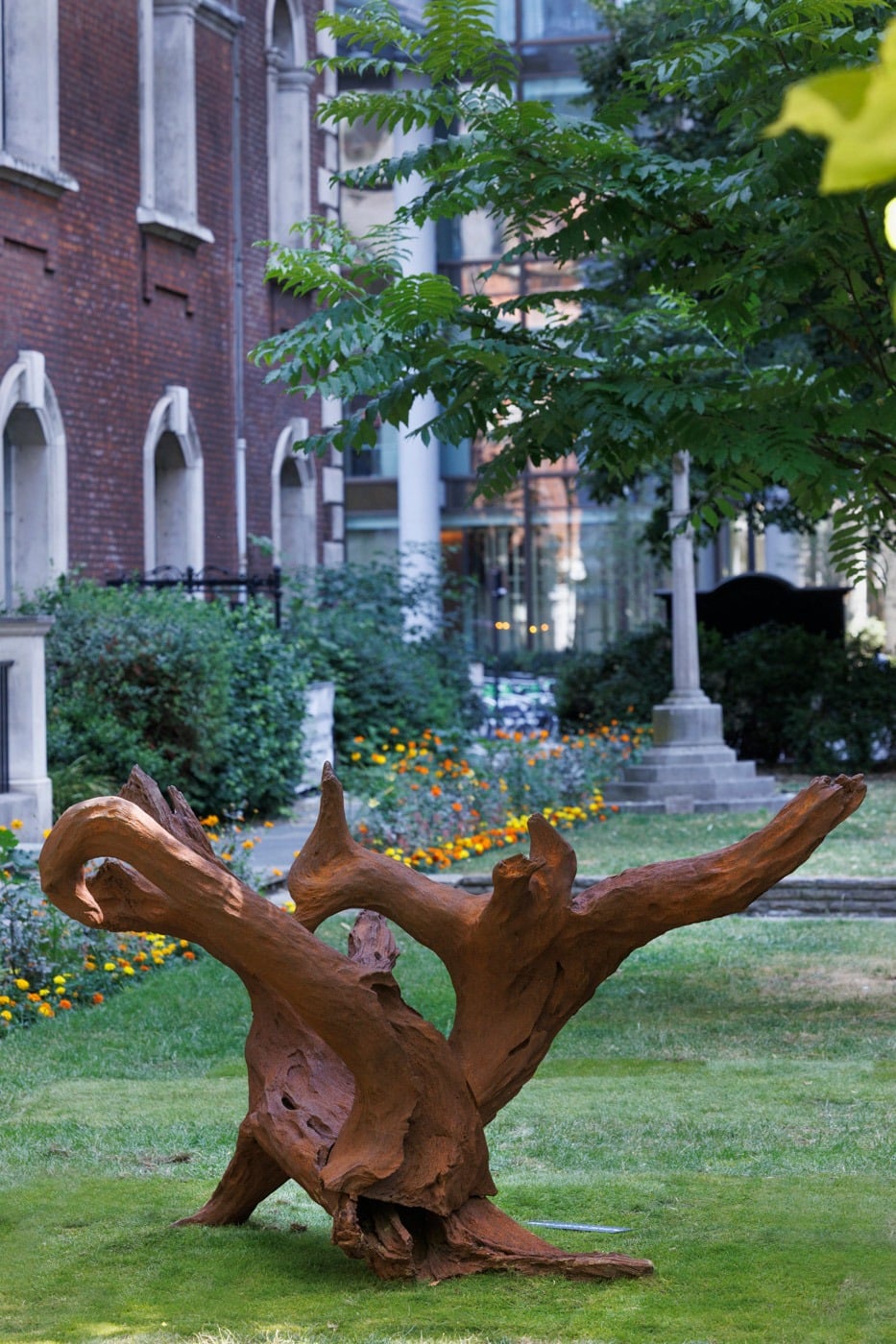 An Ai Weiwei sculpture resembling a gnarled tree root, sited in a City of London courtyard
