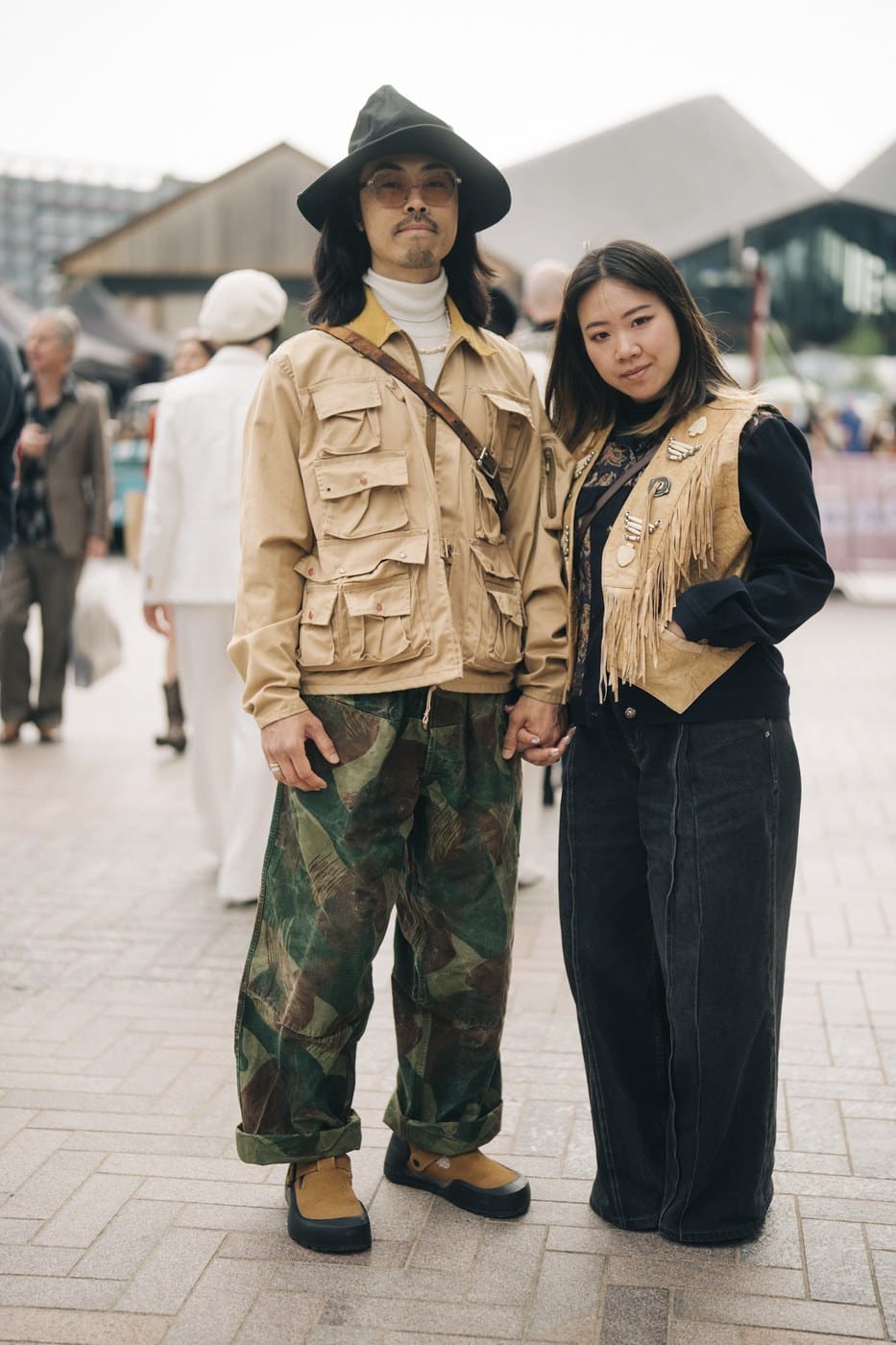 A couple in vintage workwear and a fringed suede waistcoat at the Classic Car Boot Sale