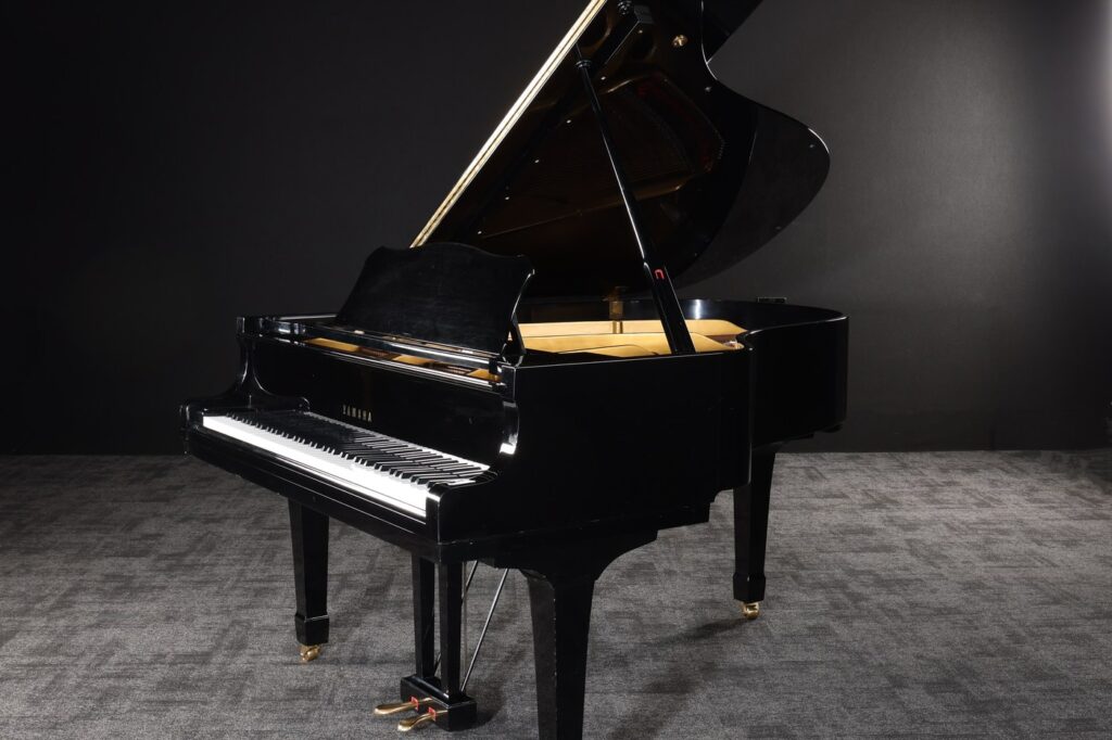 Black Yamaha C3 grand piano with the lid raised, played by Freddie Mercury at Musicland Studios