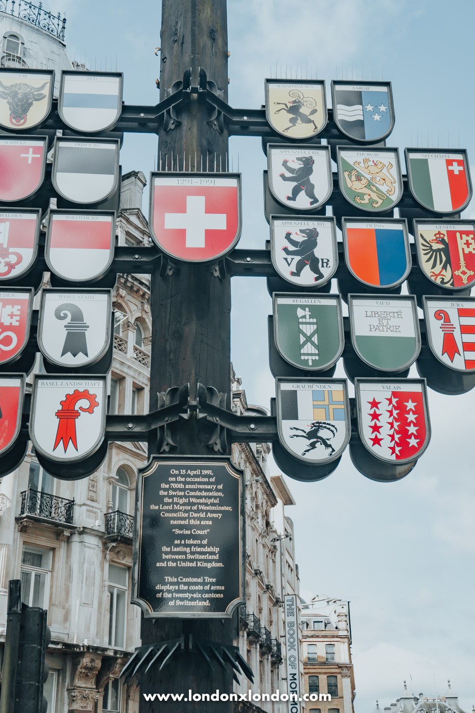 The Swiss cantonal tree hung with the coats of arms of the 26 Swiss cantons in Swiss Court London