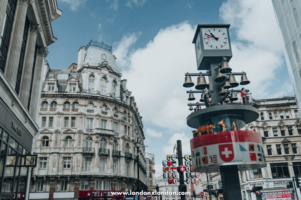 The Swiss glockenspiel and cantonal tree in Swiss Court off Leicester Square, London